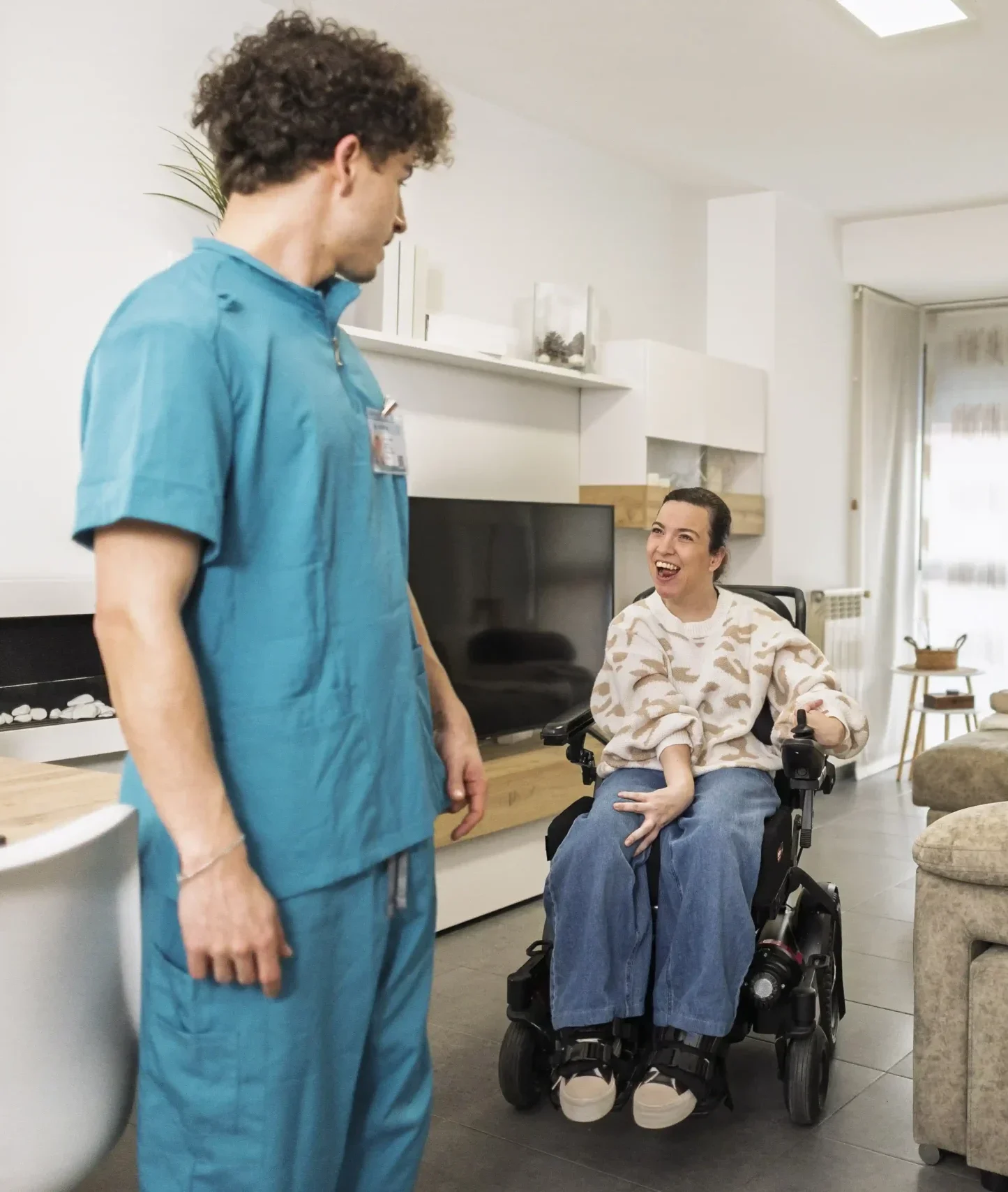 Disabled women on wheelchair looking at carer